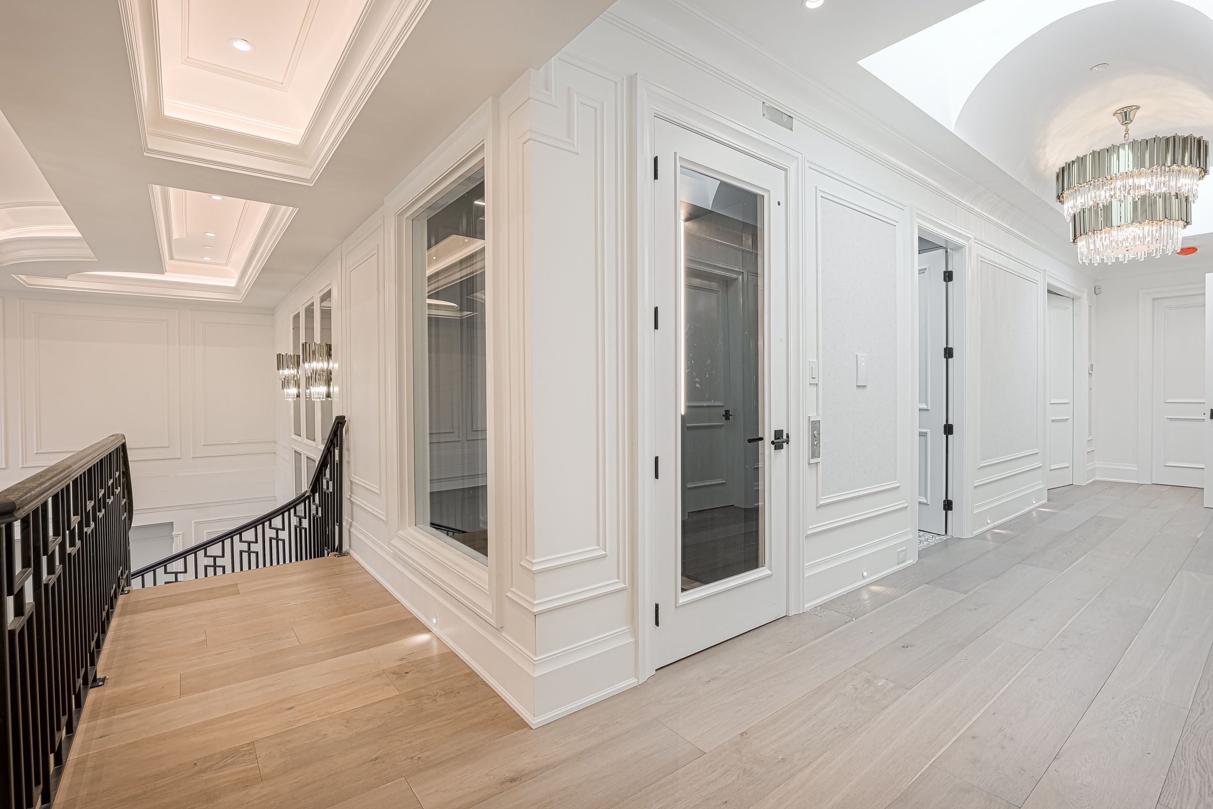 A room with two doors and a staircase
