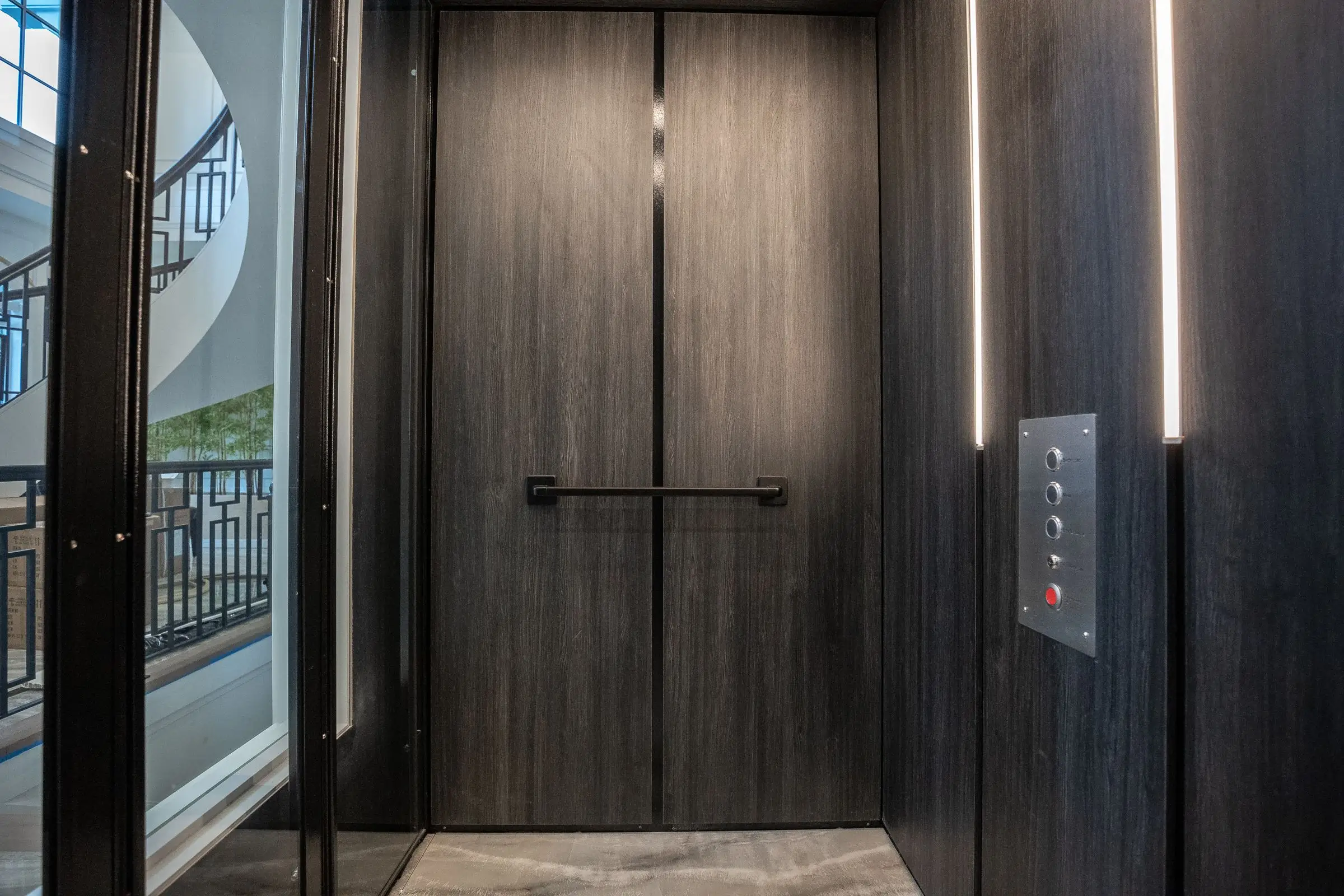 A door way with two doors and a light on. A door way with two doors and a light on.